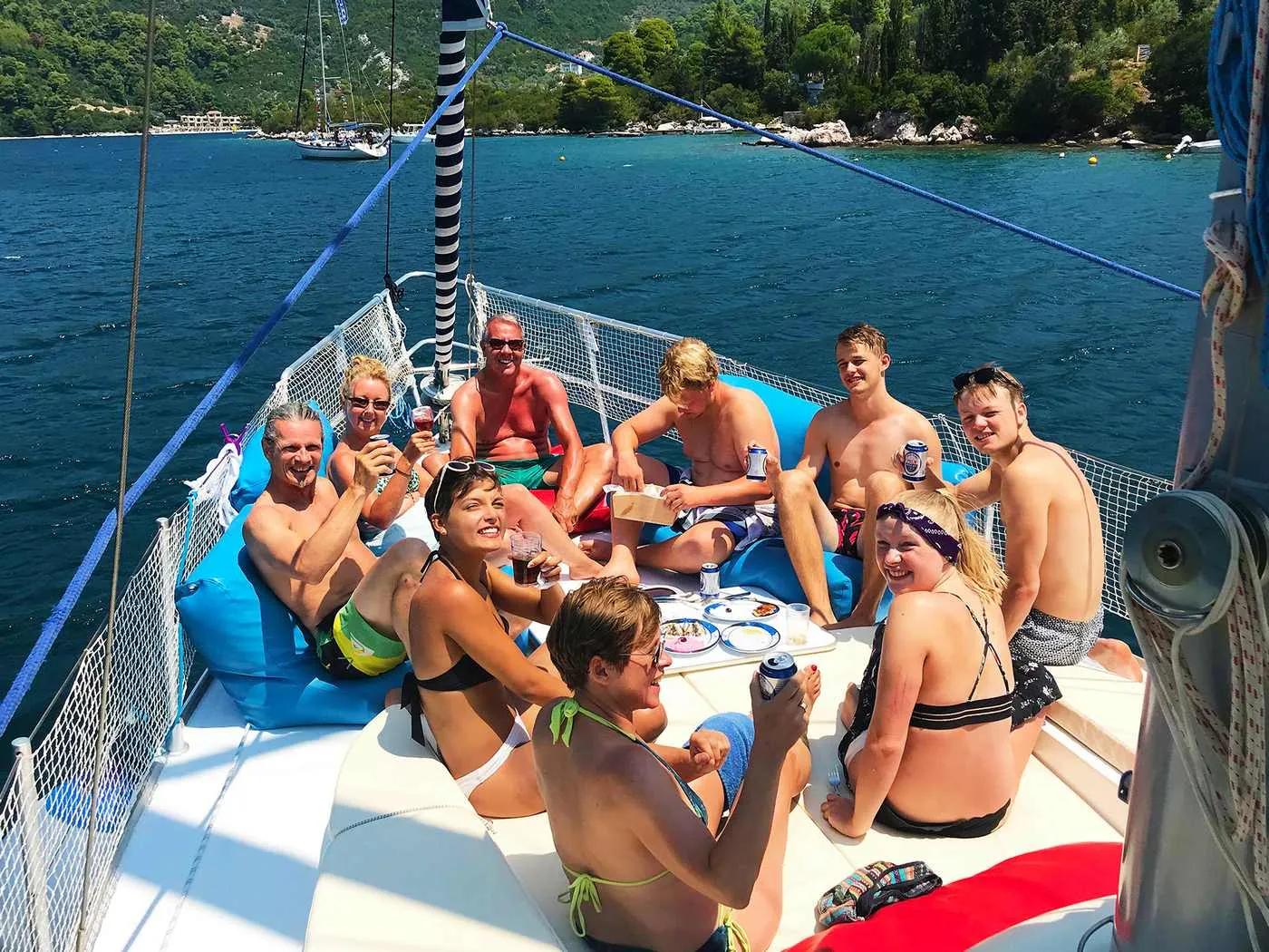 Guests relaxing on the foredeck cushions