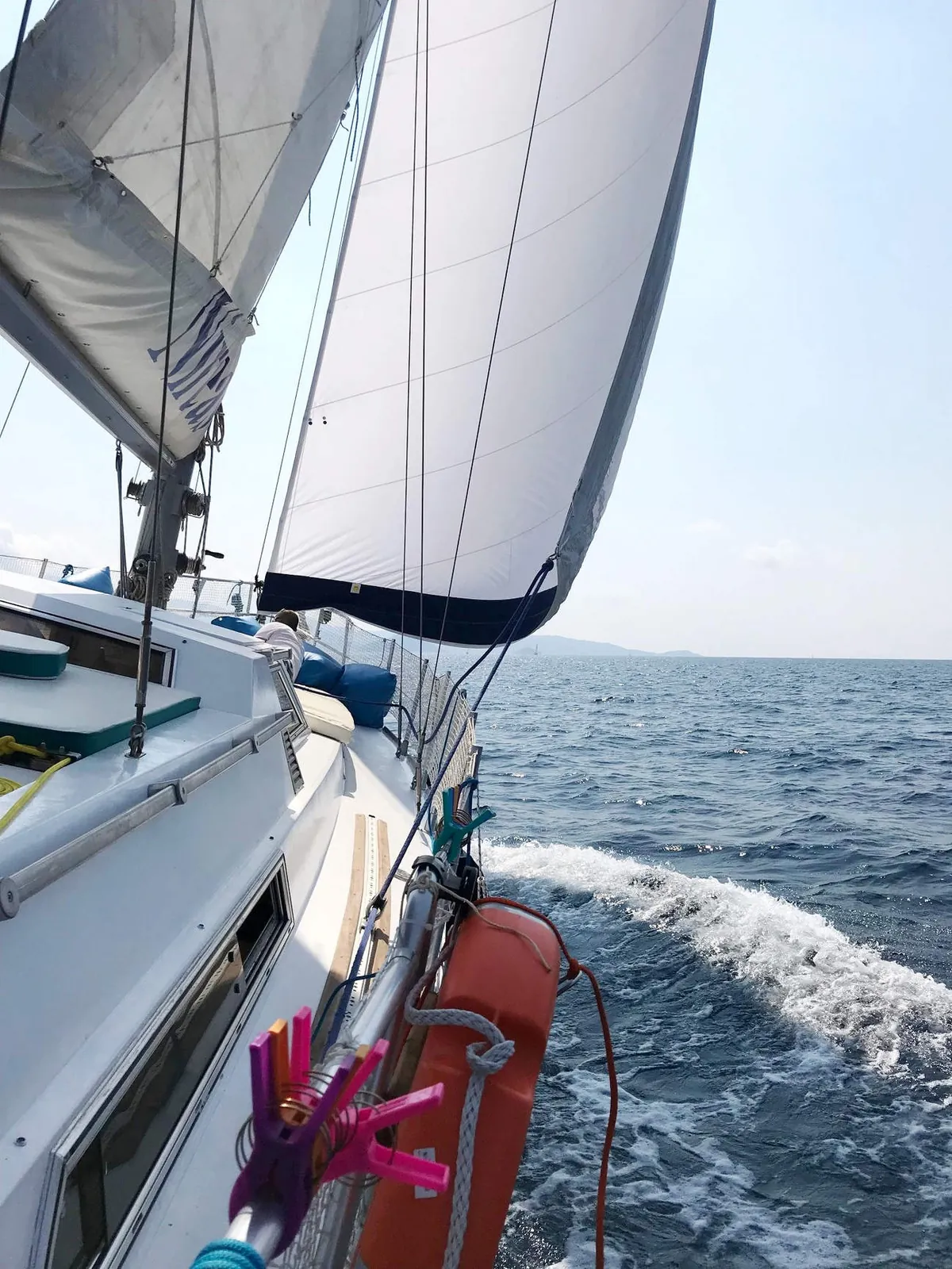 Sails full and the wake behind