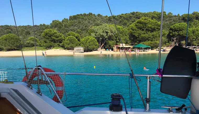 A beach and taverna seen from the boat