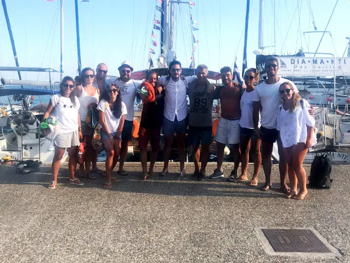 A group on the quay before sailing