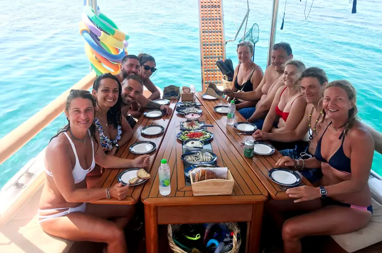 A long lunch table full of guests
