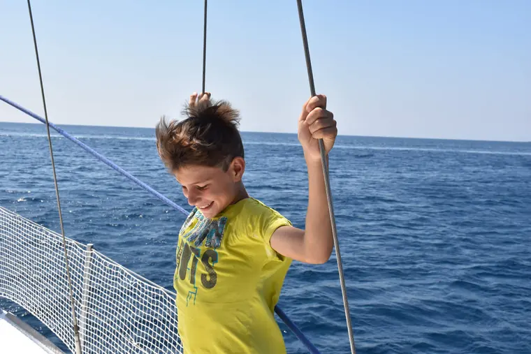 A young sailor at the bow