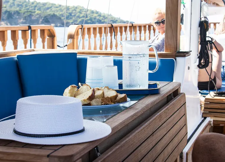 Bread and a sun hat on the cockpit table
