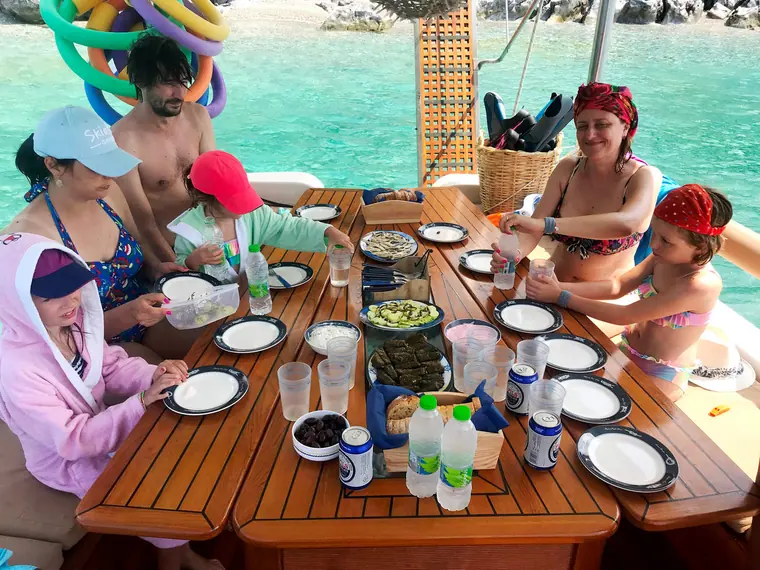 Children and adults at lunch on board