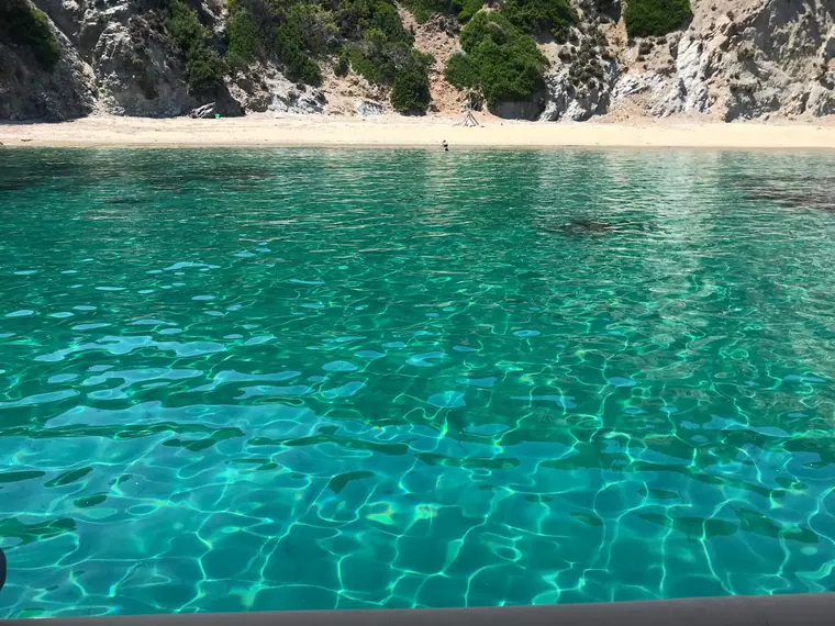 Clear water over a sandy bay