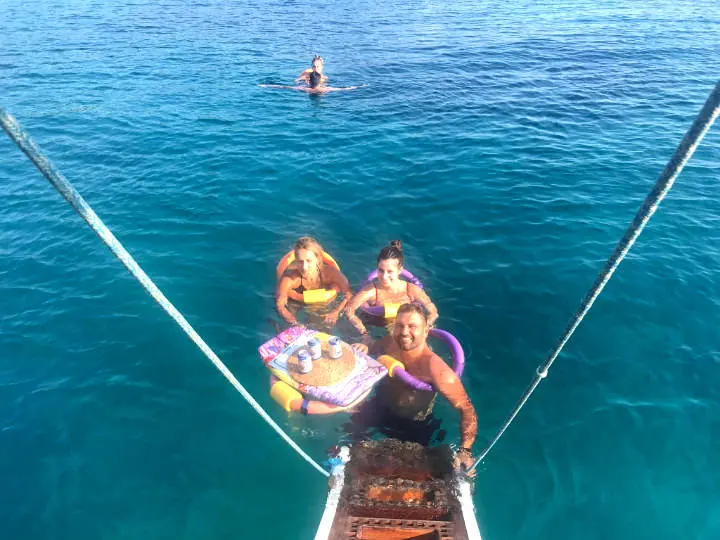 Floating off the bow in turquoise water