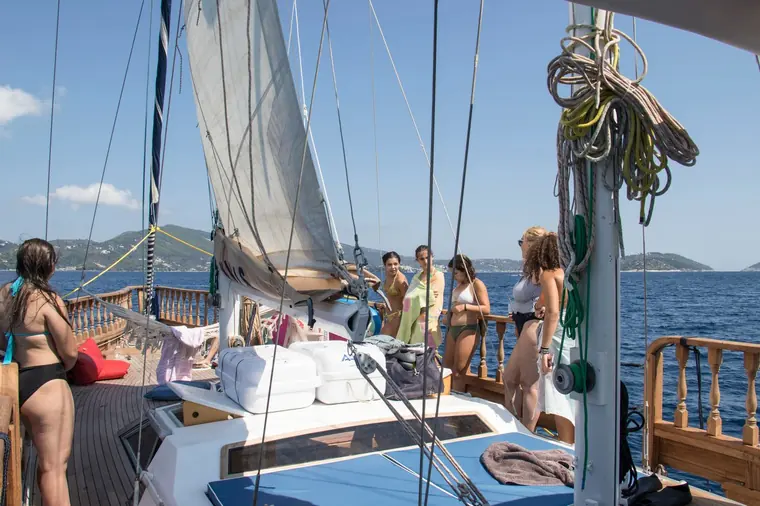 Guests on the aft deck under sail