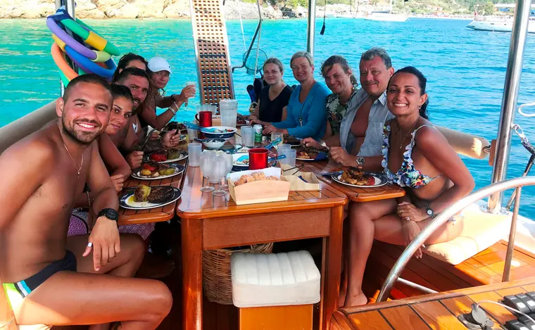 Guests smiling around the table