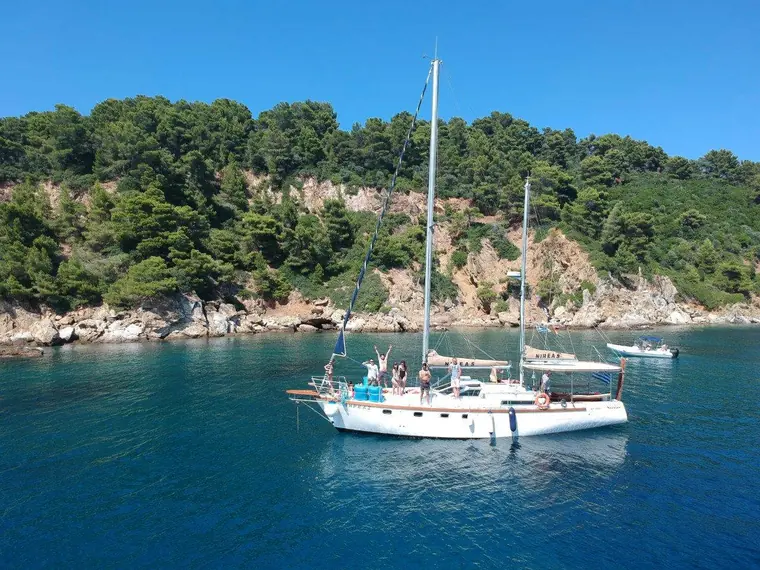 Nireas in a quiet cove below the pines