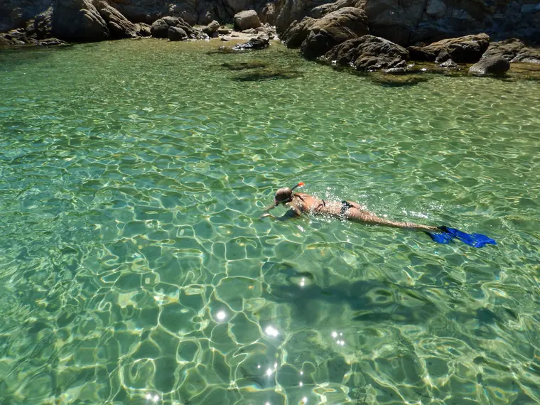 Snorkelling over clear sand