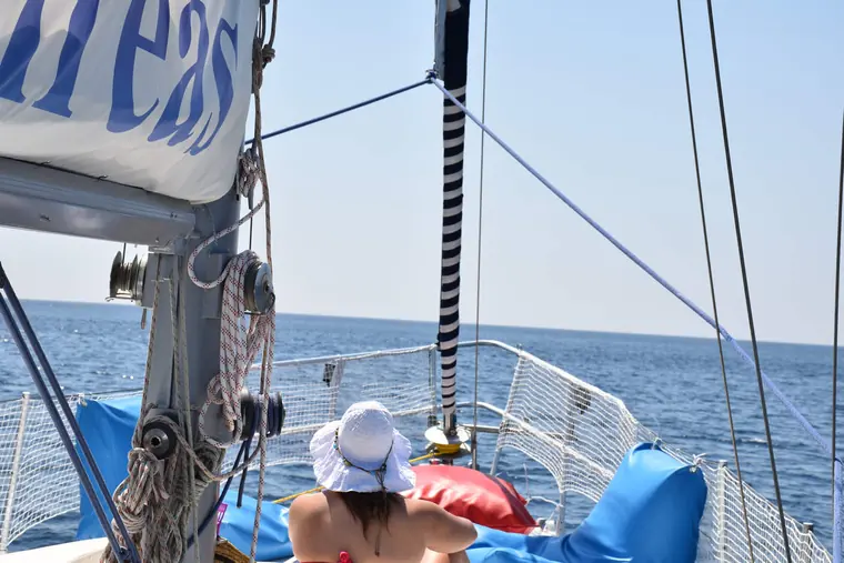 Sunbathing under the sail