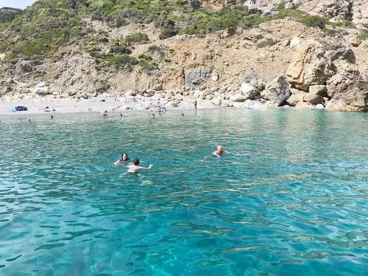 Swimming at a pebble beach