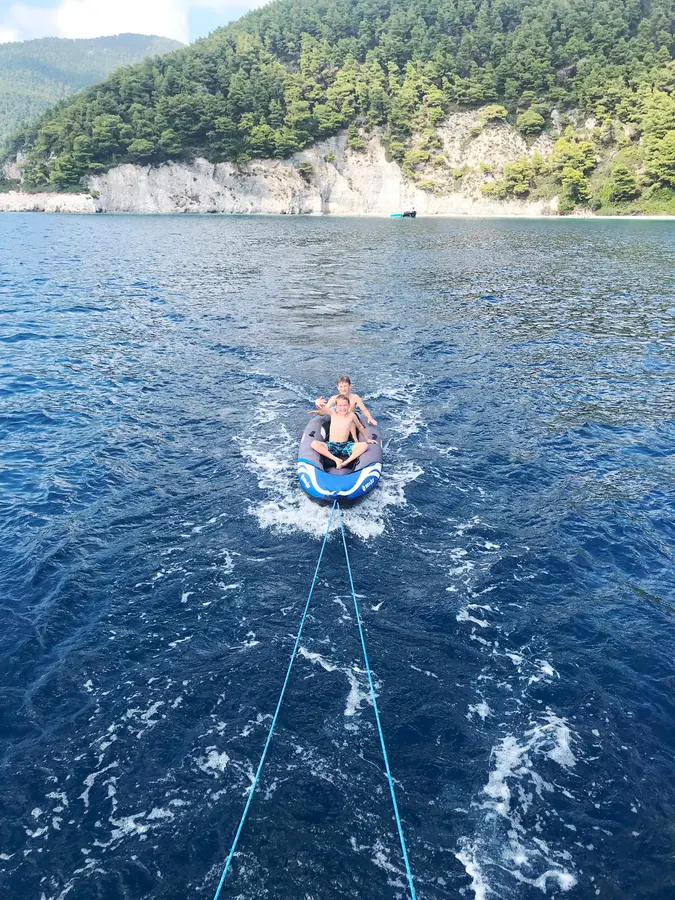 Towed on a ring behind the boat