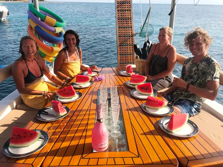 Watermelon at a sunny lunch table